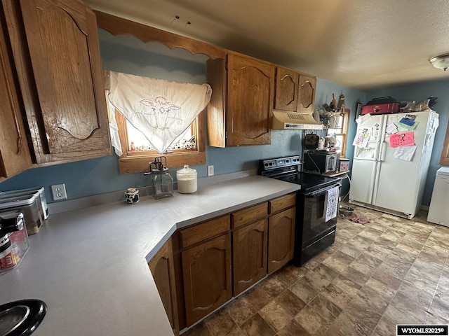 kitchen with black electric range oven, white fridge with ice dispenser, and a textured ceiling