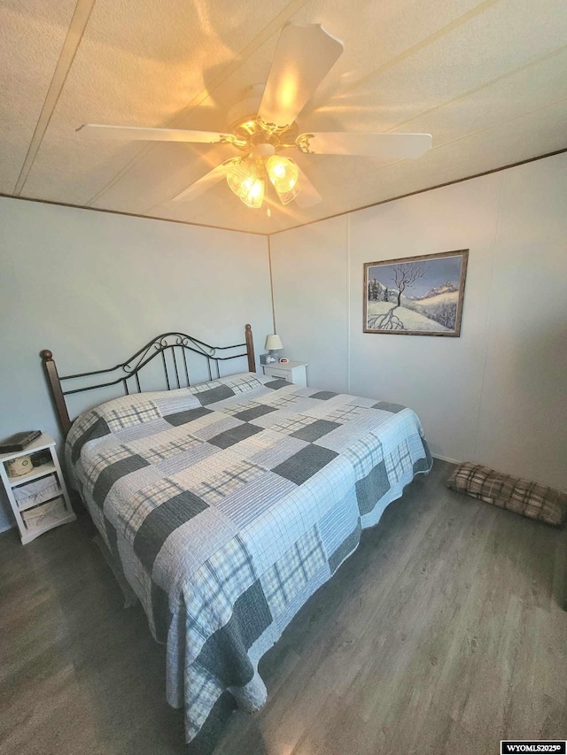 bedroom featuring ceiling fan and hardwood / wood-style floors