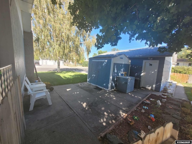 view of patio featuring a shed