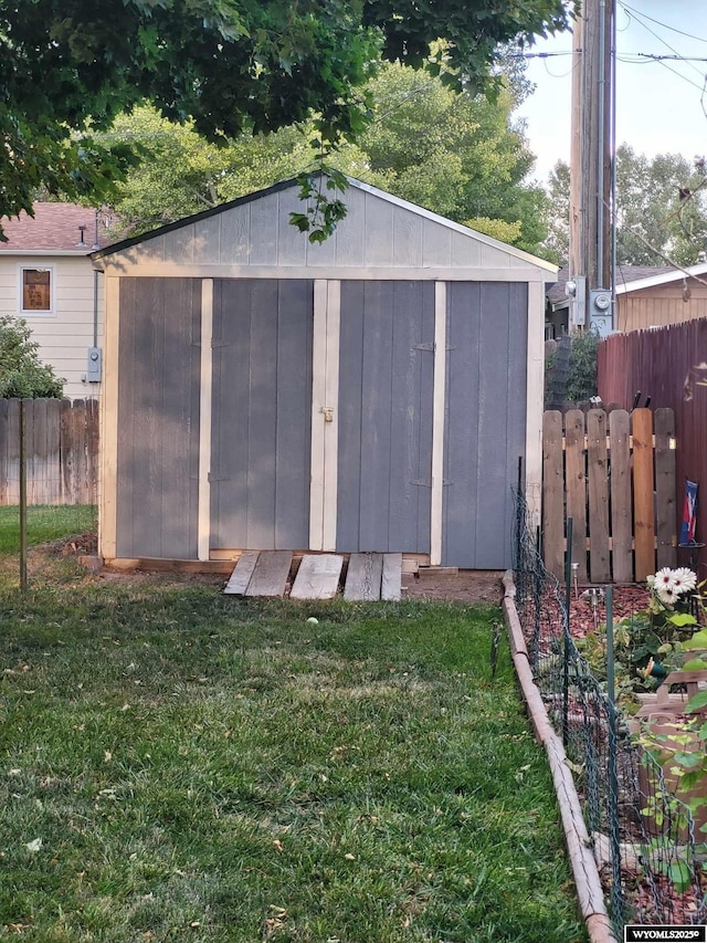 view of outdoor structure with a lawn