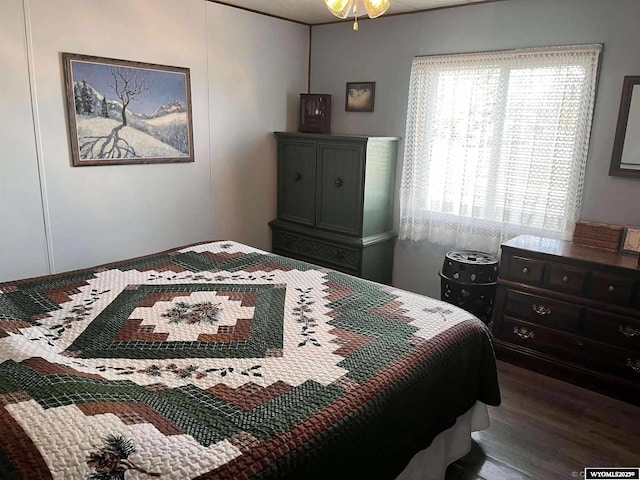 bedroom with hardwood / wood-style flooring