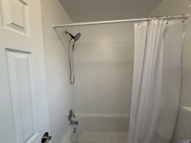 bathroom featuring shower / bathtub combination with curtain