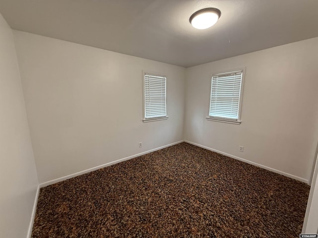 unfurnished room with carpet floors