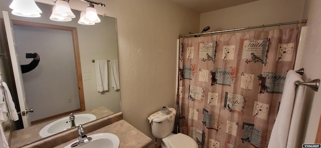 bathroom with vanity, toilet, and a shower with shower curtain