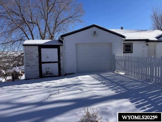 view of snow covered garage