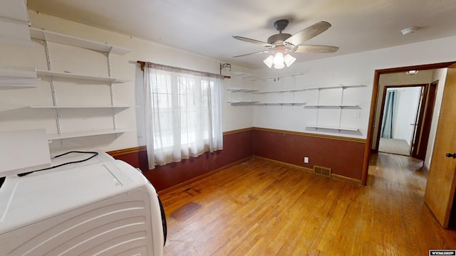 washroom featuring ceiling fan, separate washer and dryer, and light wood-type flooring