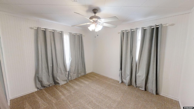 carpeted empty room with ceiling fan