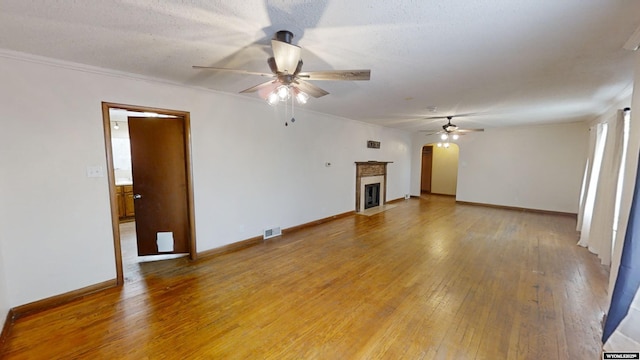 unfurnished living room featuring hardwood / wood-style floors, a textured ceiling, and ceiling fan