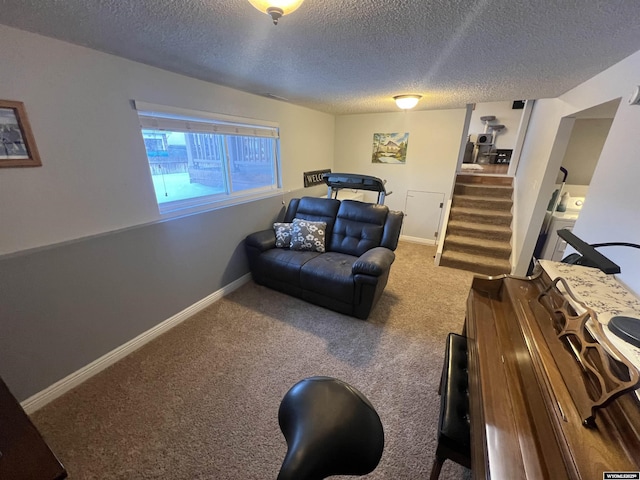 living room featuring carpet flooring and a textured ceiling