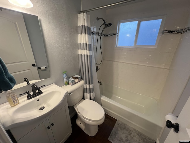 full bathroom featuring shower / tub combo, vanity, and toilet