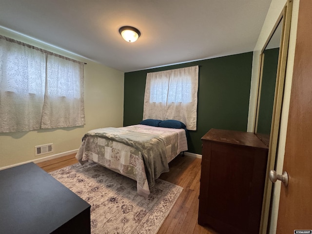 bedroom featuring wood-type flooring