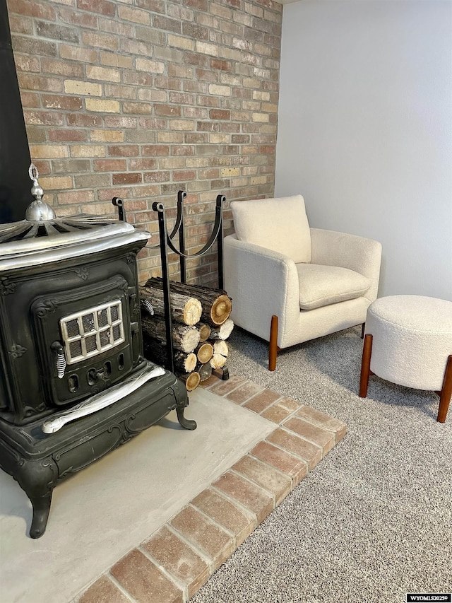 living area featuring carpet floors and a wood stove