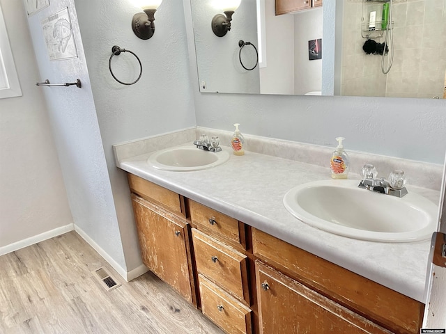 bathroom featuring vanity and hardwood / wood-style floors