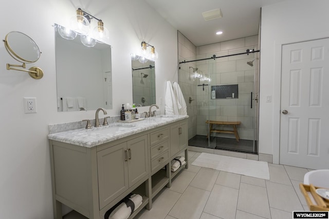 bathroom featuring walk in shower, tile patterned floors, and vanity