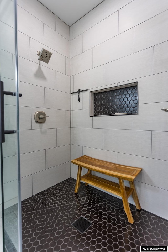 bathroom with tiled shower