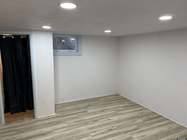 basement featuring light hardwood / wood-style floors