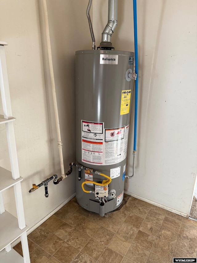 utility room featuring gas water heater