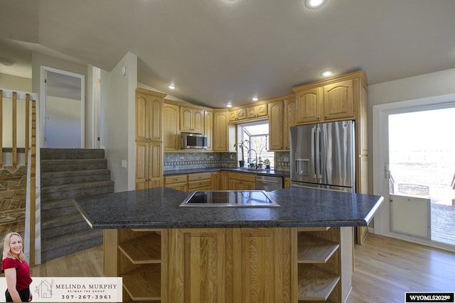 kitchen featuring appliances with stainless steel finishes, dark countertops, lofted ceiling, and open shelves