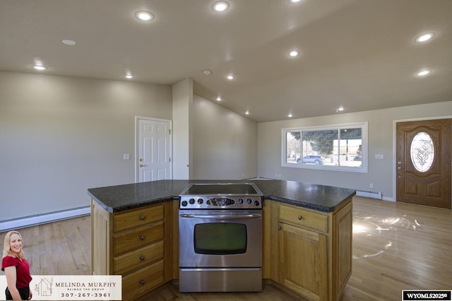 kitchen featuring recessed lighting, a kitchen island, vaulted ceiling, light wood-type flooring, and stainless steel range with electric stovetop