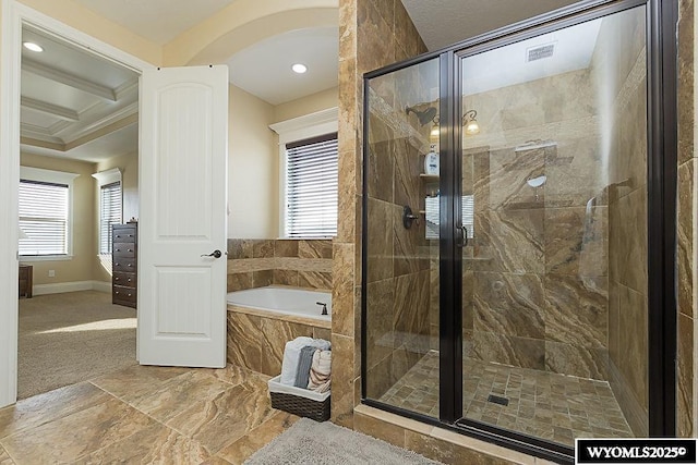 bathroom with a wealth of natural light, ornamental molding, and independent shower and bath