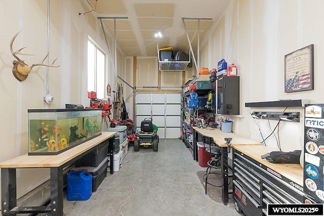 garage with a workshop area