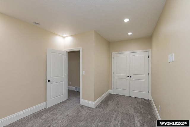 interior space featuring carpet floors and a closet