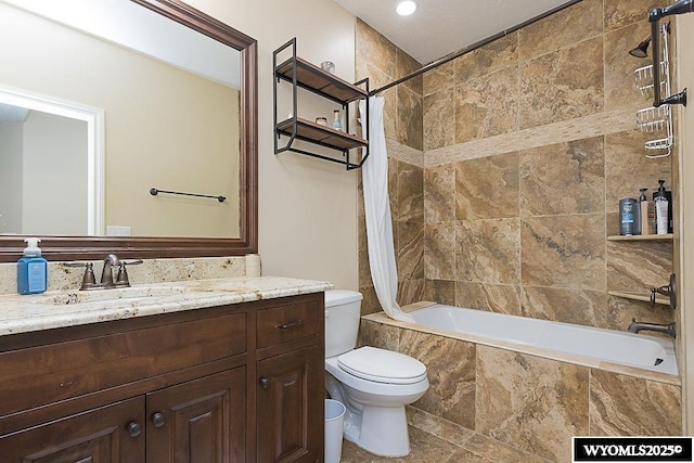 full bathroom with vanity, toilet, and shower / bath combo with shower curtain