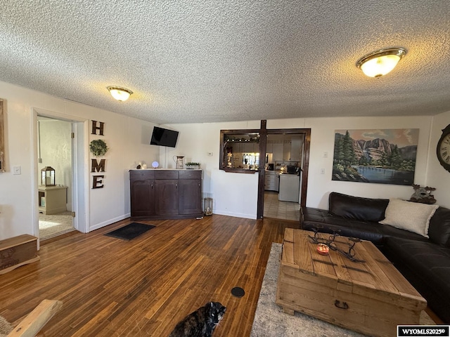 living room featuring hardwood / wood-style floors and a textured ceiling