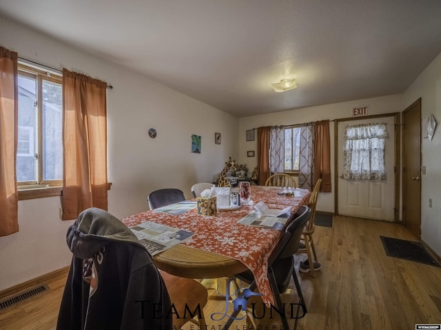 dining room with hardwood / wood-style floors