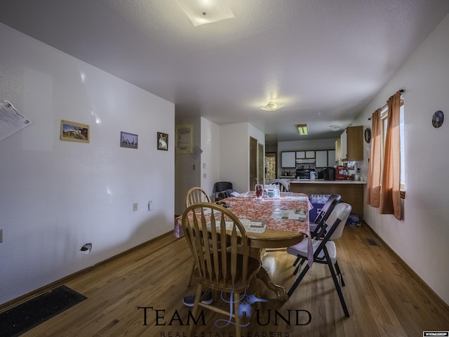 dining area featuring hardwood / wood-style flooring