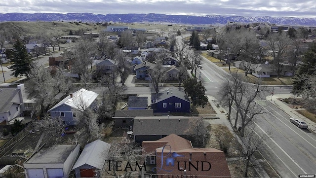 birds eye view of property featuring a mountain view