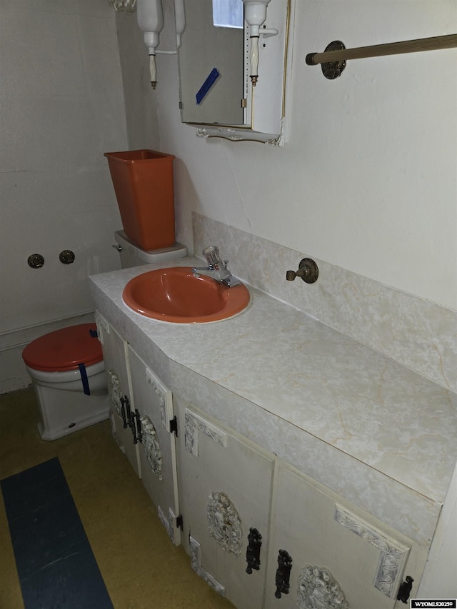 bathroom with vanity and toilet