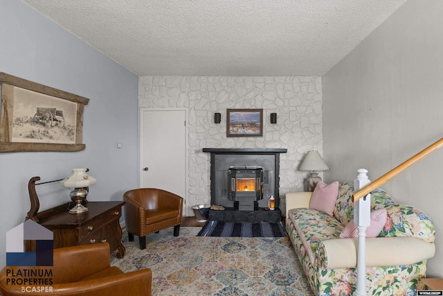 living room with hardwood / wood-style flooring and a textured ceiling