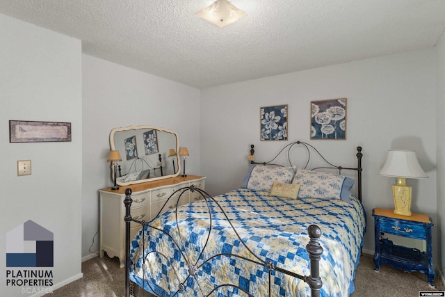 carpeted bedroom featuring a textured ceiling