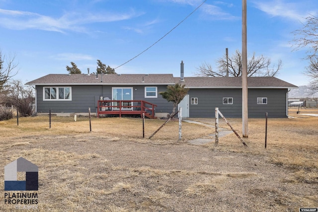 back of house featuring a wooden deck