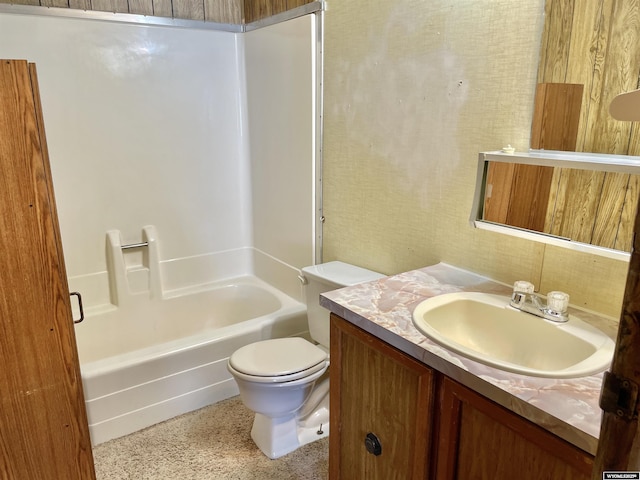 full bathroom with vanity, toilet, and  shower combination