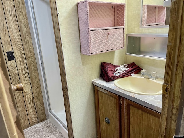 bathroom with vanity and an enclosed shower