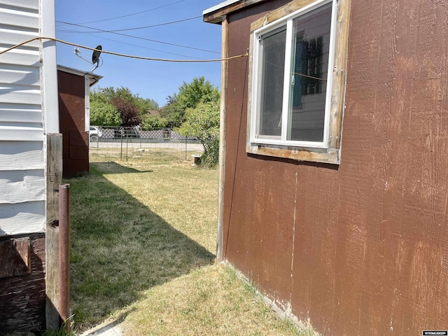 view of home's exterior featuring a yard