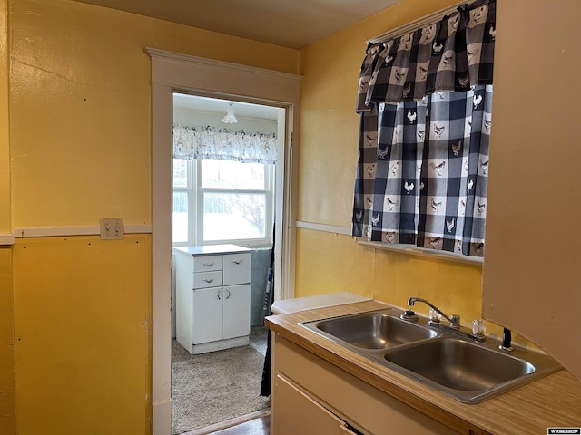 kitchen with sink and white cabinets