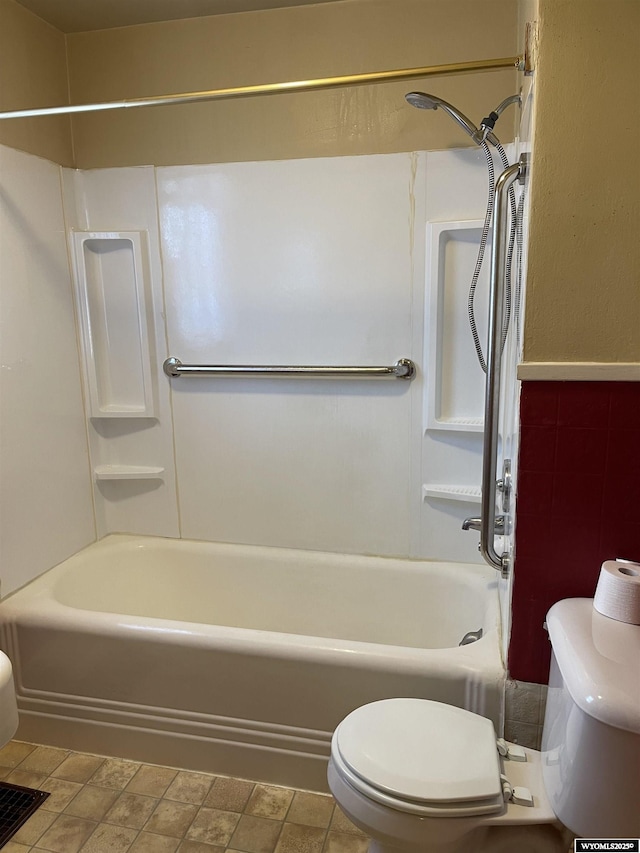 bathroom with shower / tub combination and toilet