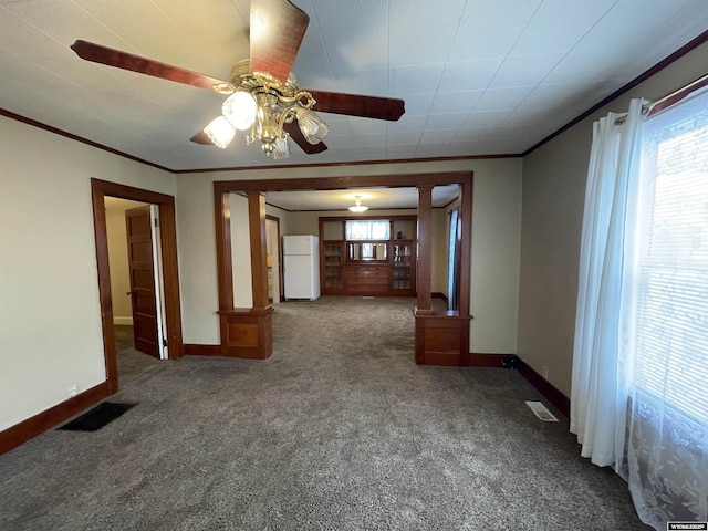 carpeted empty room with ornamental molding and ceiling fan