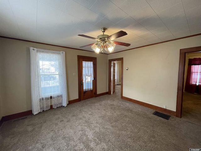 carpeted empty room featuring ceiling fan and ornamental molding