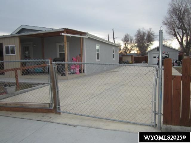 view of gate with fence