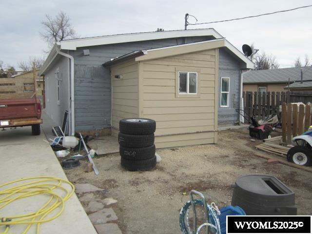 rear view of house with fence