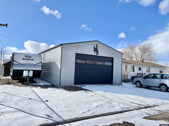 view of snow covered garage