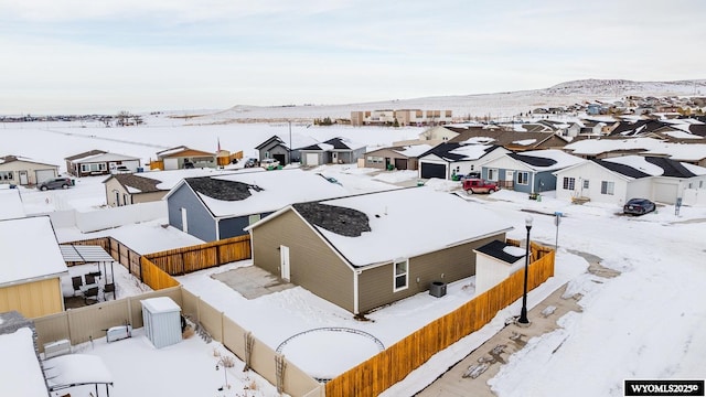 snowy aerial view with a mountain view