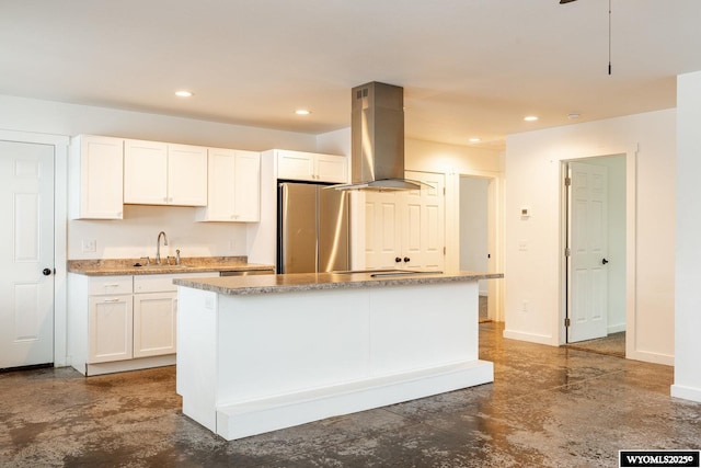 kitchen featuring white cabinetry, island exhaust hood, a center island, and stainless steel fridge