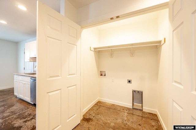 clothes washing area featuring sink, hookup for a washing machine, and electric dryer hookup