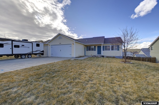 view of front of home featuring a garage and a front yard