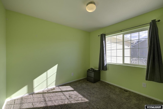 empty room featuring carpet flooring